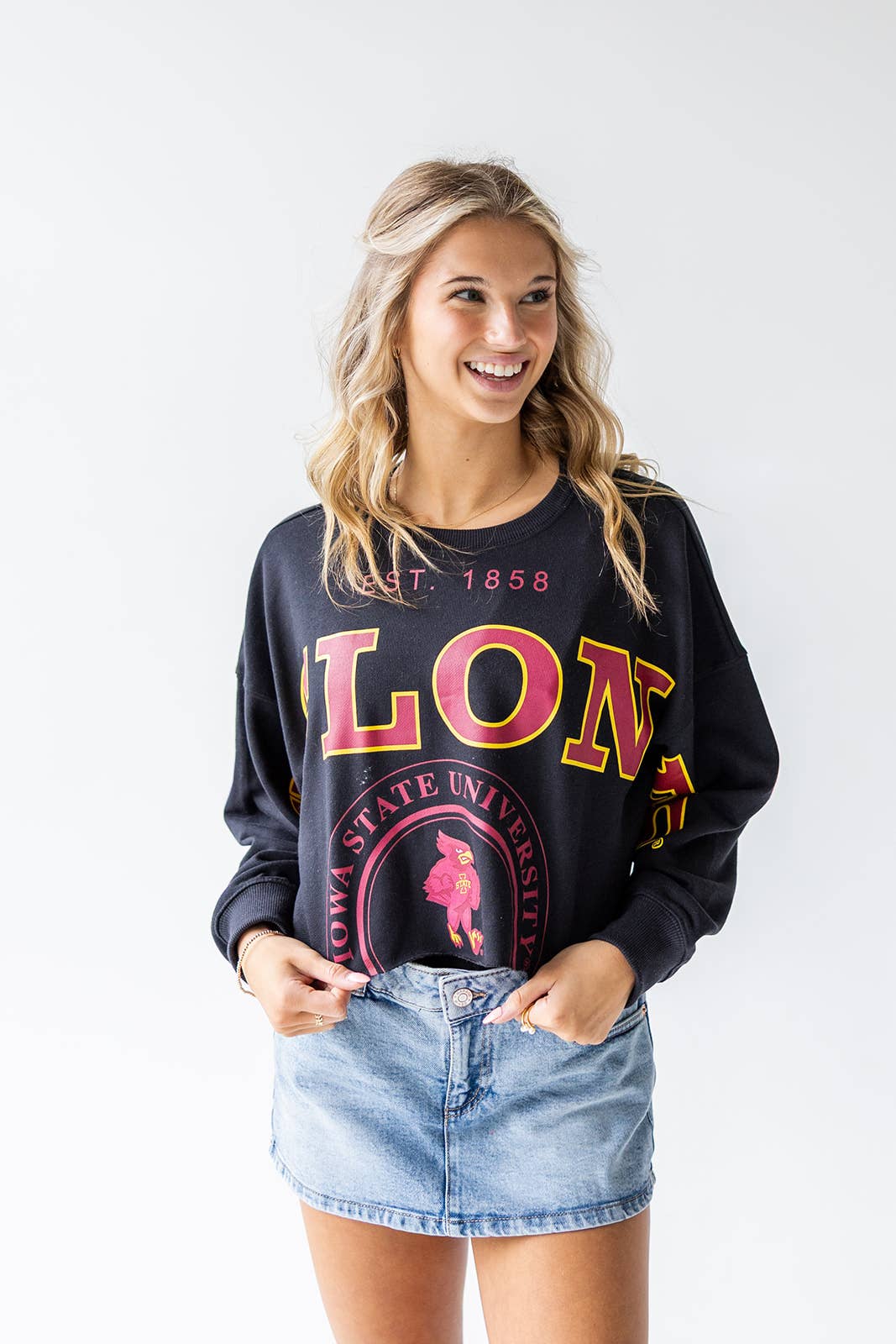 Woman wearing a black long-sleeve shirt with 'LONE STAR STATE UNIVERSITY' text and graphics.